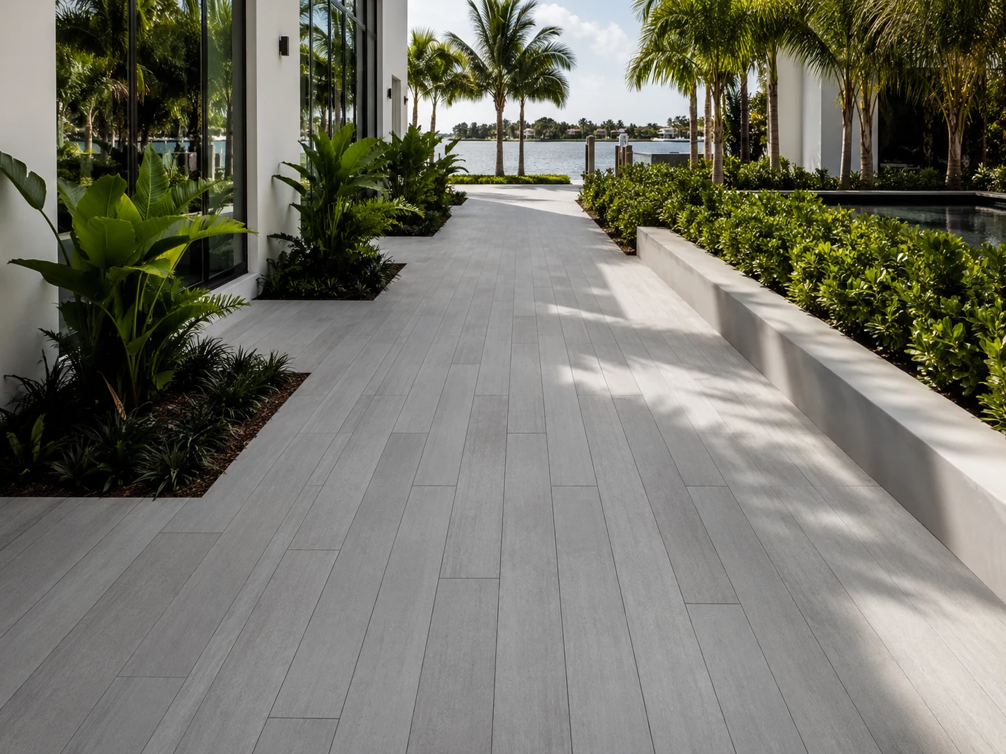 Plank and linear pavers forming a long modern waterfront walkway